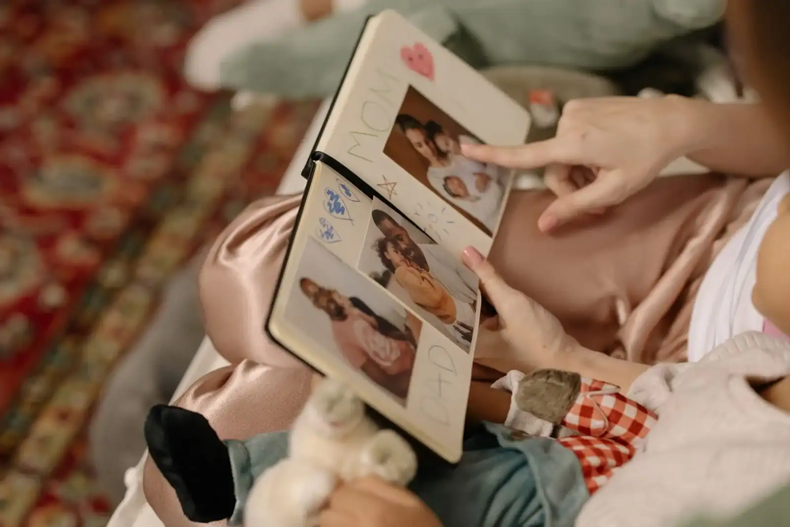 Hands turning the pages of a photo album