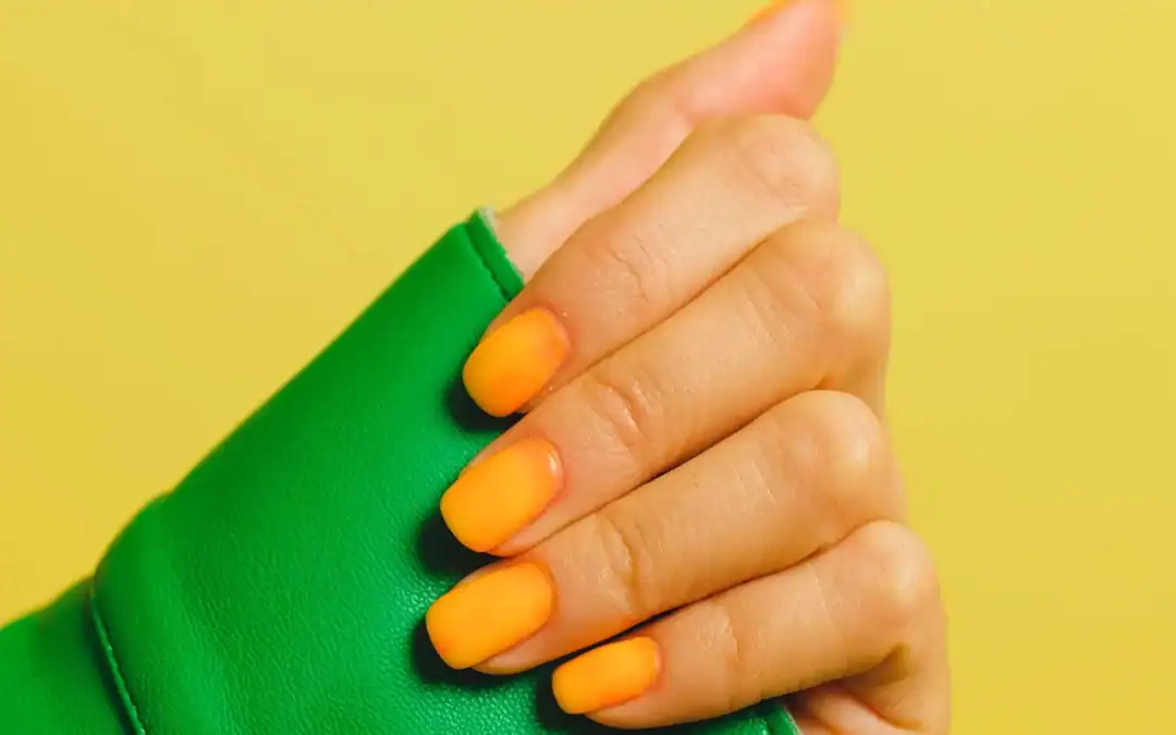 Orange nail designs: sun-warmed shades from soft apricot to burnt orange.